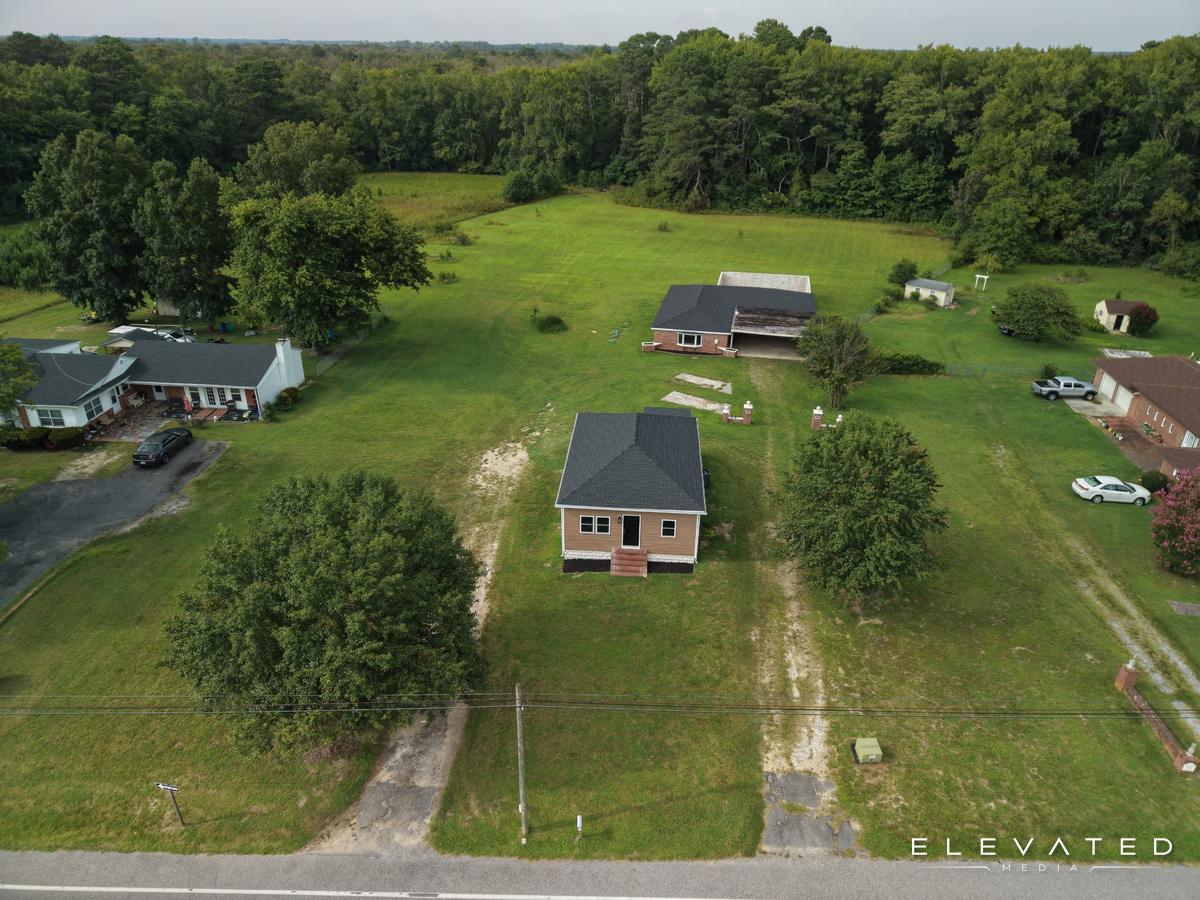 Small brick home on an open rural lot